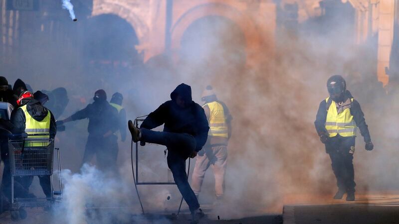 Street protests in Nimes where violence erupted among a fog of tear gas. Photograph: EPA