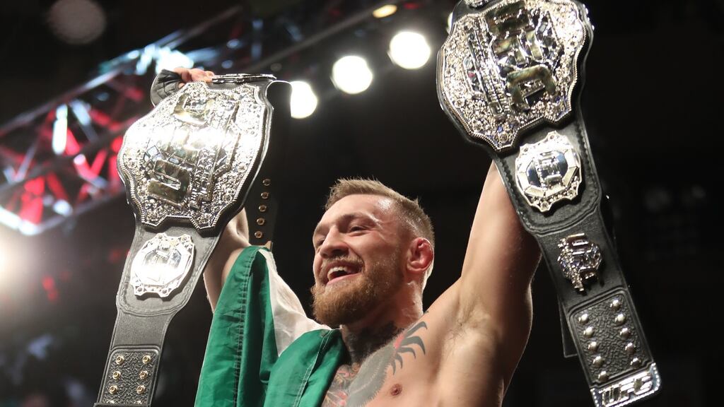 Conor McGregor celebrates winning the lightweight title last month. Photograph: Tom Hogan/Inpho