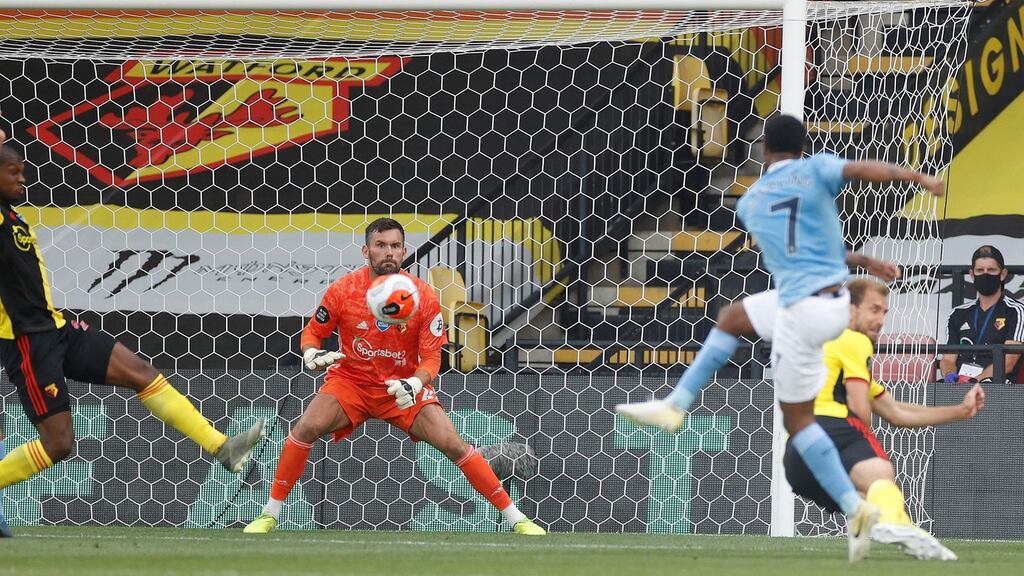 Raheem Sterling drives home the first of his two goals past Watford goalkeeper Ben Foster during the Premier League game at Vicarage Road. Photograph: John Sibley/AFP via Getty Images