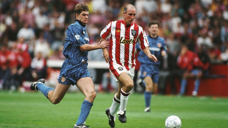 Gary Pallister of Manchester United chases Alan Cork of Sheffield United on the opening day. Photo: Getty Images