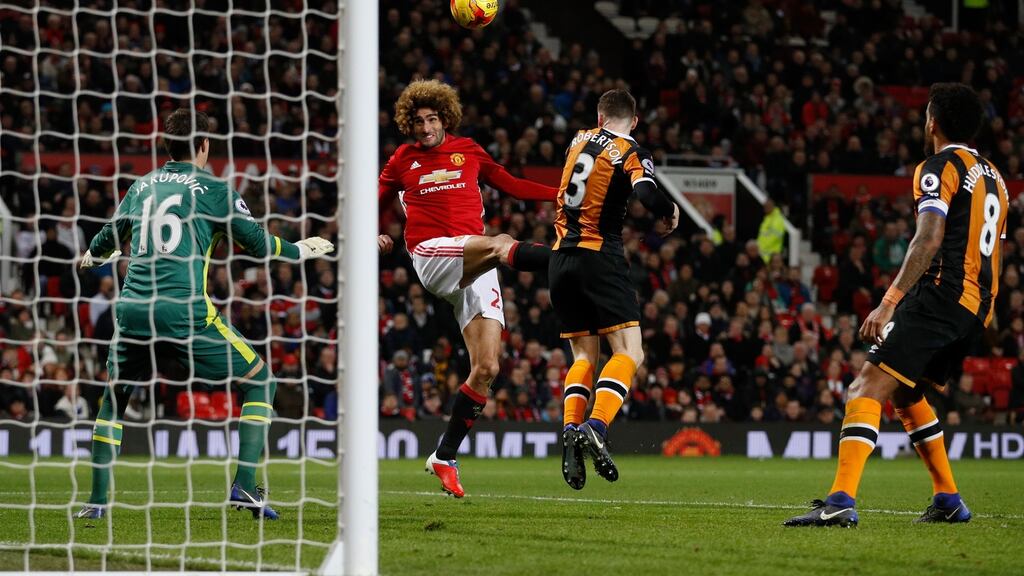 Manchester United’s Marouane Fellaini rises above the Hull defence to score his side’s second goal at Old Trafford last night. Photograph: Phil Noble, Reuters.
