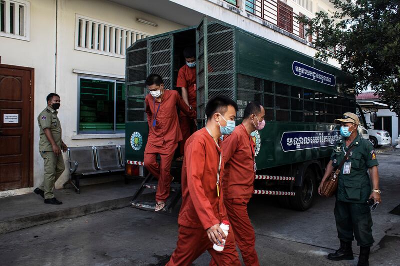 Xu Wenjun, centre, arrives at court for an appeal, in Phnom Penh, Cambodia. Photograph: Nadia Shira Cohen/The New York Times