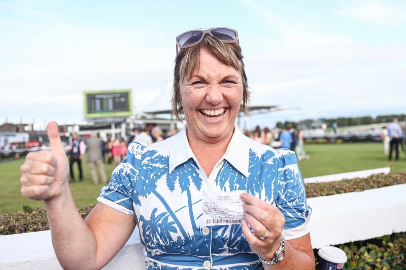 Racegoer Sinead O’Neill from Roscam, Galway, celebrates a 200/1 winning bet after Aine O’Connor’s victory with Brave Crogha. Photograph: ©INPHO/Tom Maher