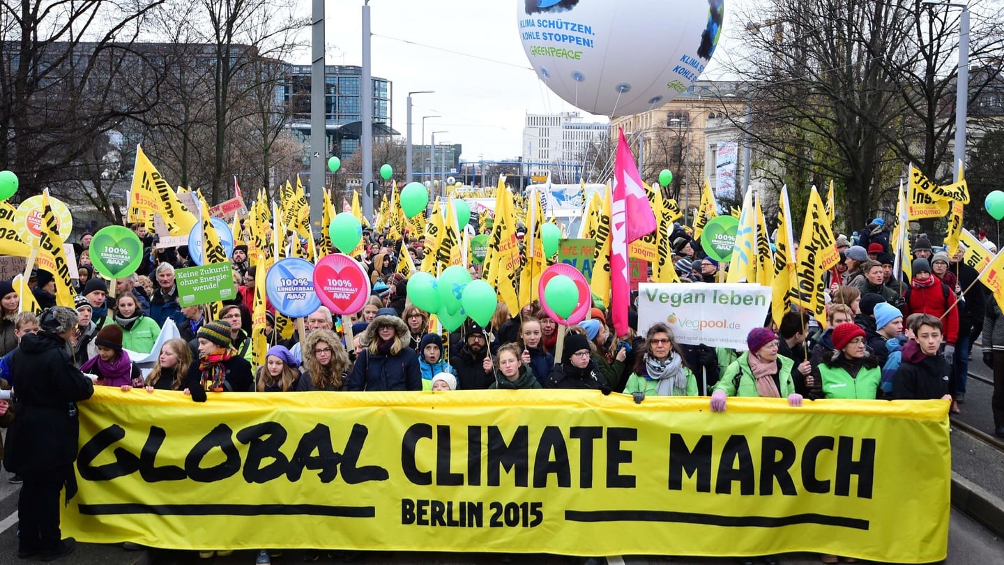 Participants hold a banner reading “Global Climate March” during a rally organised by environmental NGOs in Berlin on the eve of the official opening of a 195-nation UN climate summit in Paris. Photograph: AFP/Getty Images