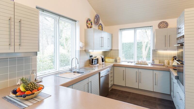 Windows and white-painted walls everywhere: the kitchen of Demarco, Violet Hill, Church Road, Killiney