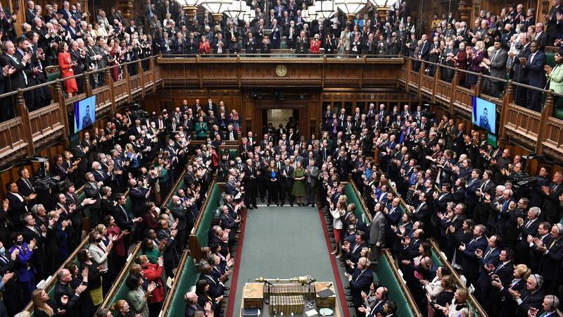 MPs give a standing ovation to Ukraine’s president Volodymyr Zelenskiy after he speaks live video-link to the House of Commons. Photograph: Jessica Taylor/UK Parliament/AFP via Getty
