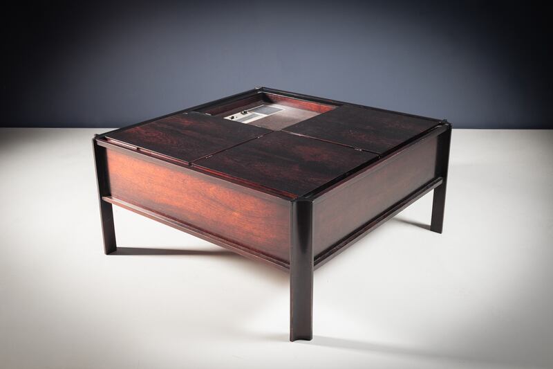 Italian rosewood bar table with a fitted vinyl turntable and hidden compartments with lift-up lids (€800-€1,200), deVeres