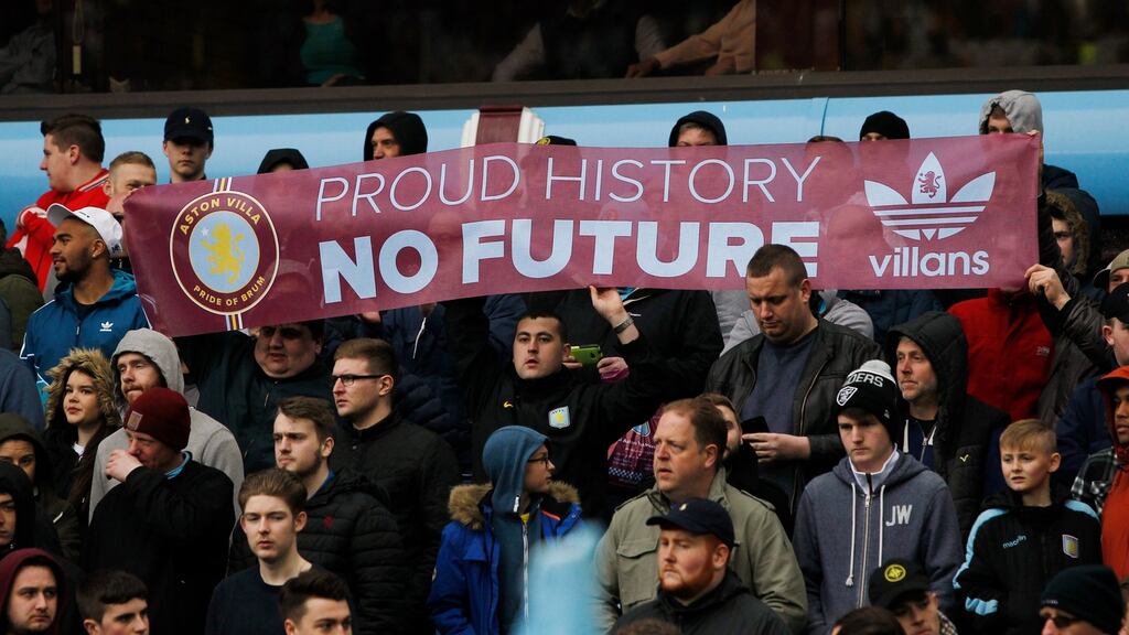 Aston Villa fans hold up a banner in protest during last weekend’s defeat. Photograph: Ed Sykes/Reuters