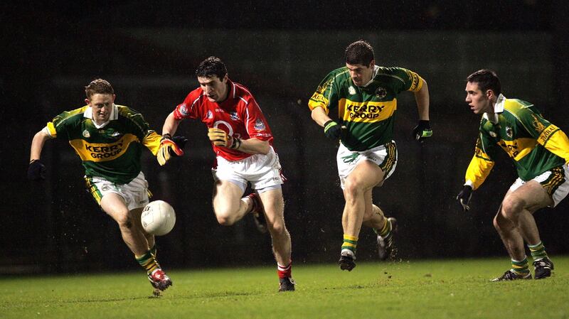 Graham Canty of Cork is chased by Colm Cooper, Eamonn Fitzmaurice and Declan O’Sullivan of Kerry during a 2006 league match. Photo: Lorraine O’Sullivan/Inpho