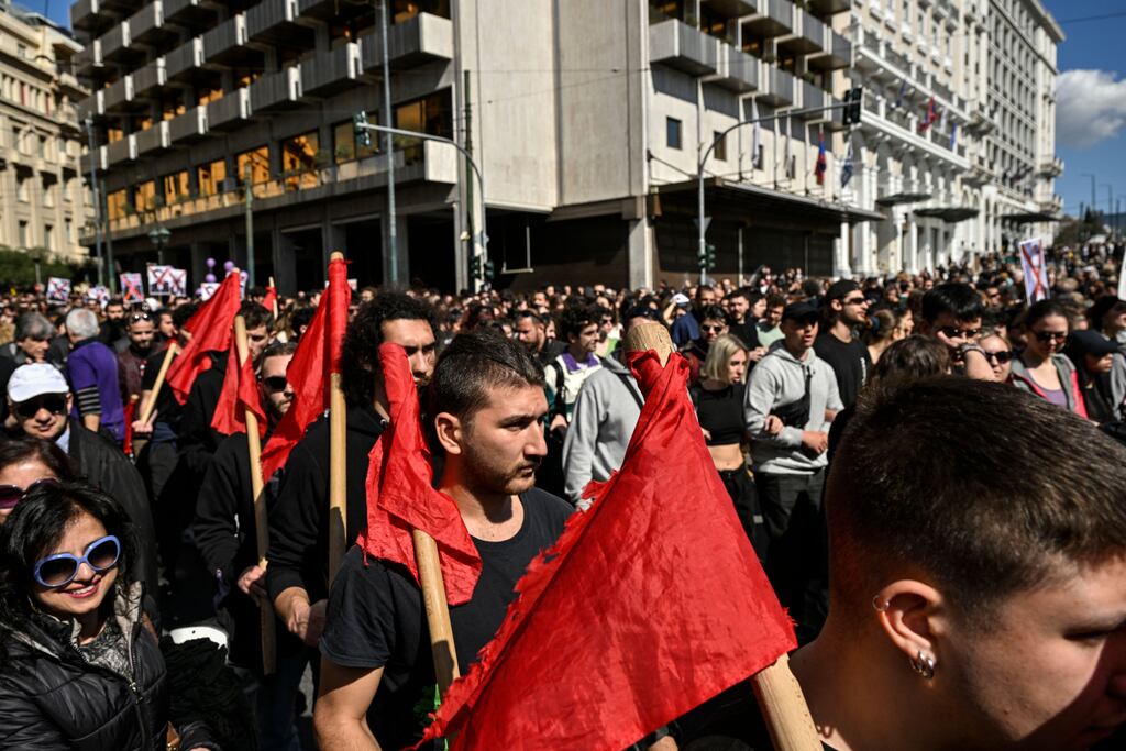 Students march as they take part in a demonstration during a nationwide day of mass strikes and protests on Wednesday  over Greece's worst rail tragedy (Photo by Louisa Gouliamaki / AFP)