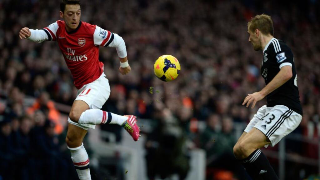 Arsenal’s Mesut Ozil (left) demonstrates his artistry as he takes on Southampton’s Luke Shaw during the Premier League match at the Emirates. Photograph: Dylan Martinez/Reuters