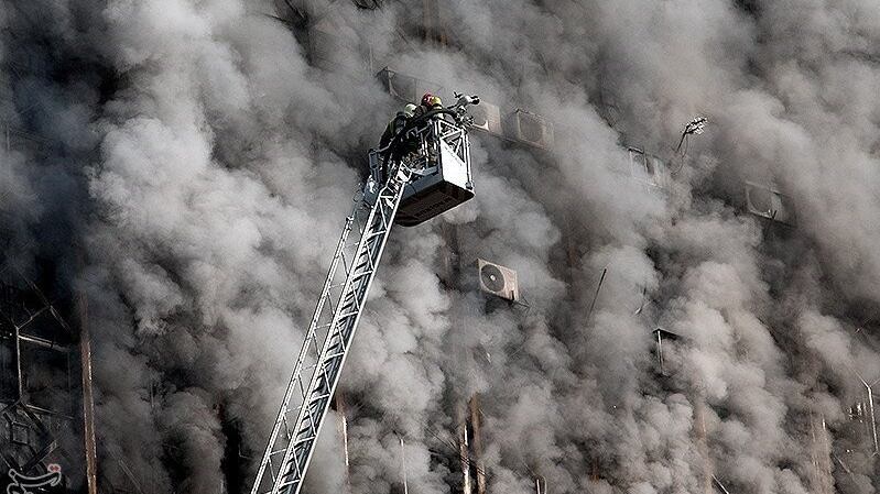 Firefighters try to put out a fire in a blazing high-rise building in Tehran. Photograph: Reuters