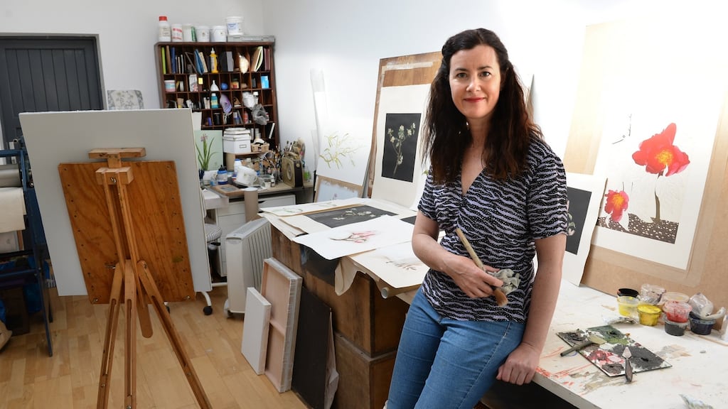 Botanical artist Cliona Doyle in her home studio in Drumcondra, Dublin 9. It comprises 136sq m (1,463sq ft) with a further 32sq m (344sq ft) in the converted attic. Photograph: Dara Mac Dónaill