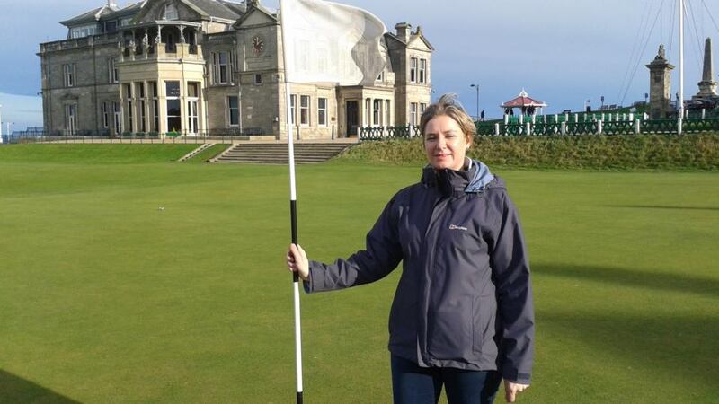 Madeleine Lyons on the 18th green of the Old Course at St Andrews. The Royal and Ancient headquarters is in the background