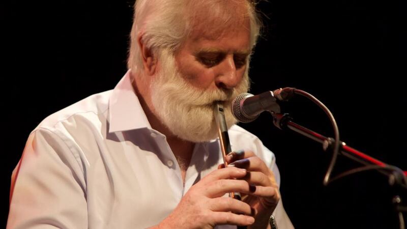 John Sheahan playing the tin whistle.