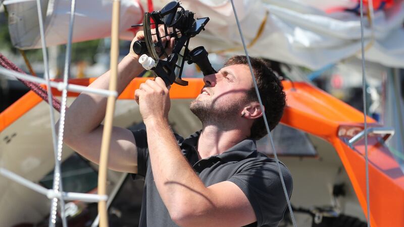 Gregor McGuckin checking a sextant. Photograph: Niall Carson/PA Wire
