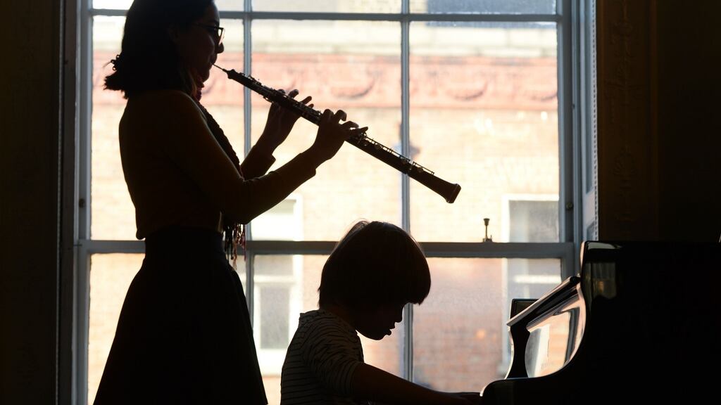Royal Irish Academy of Music student Maria Rojas and Milo O’Brien (7), a participant in Le Chéile, at the launch of Ireland’s first national orchestra for disabled musicians. Photograph: Alan Betson