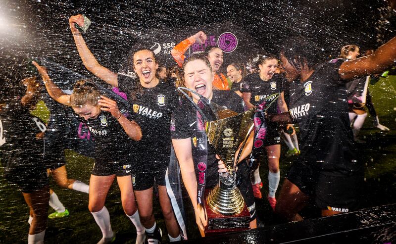 Athlone’s Laurie Ryan lifts the SSE women's premier division trophy after their match against Bohemians on Saturday. Photograph: Ryan Byrne/Inpho