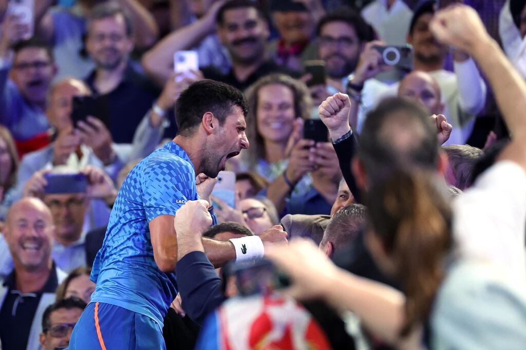 Novak Djokovic celebrates after winning the Australian Open. Photograph: Cameron Spencer/Getty Images
