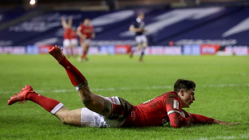 Louis Rees-Zammit dives to score his wonder try against Scotland. Photograph: Tommy Dickson/Inpho