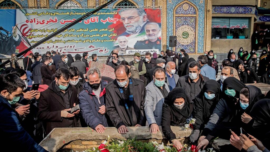 Iranian mourners attend the burial ceremony of slain nuclear scientist Mohsen Fakhrizadeh at Imamzadeh Saleh shrine in northern Tehran on Monday. Photograph: Getty