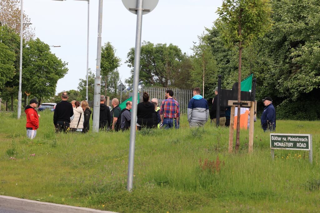 A group of protesters gathered at Monastery Road, Clondalkin, Dublin on Thursday evening voicing opposition to plans to use a local office building for emergency accommodation for asylum seekers. Photograph: The Irish Times