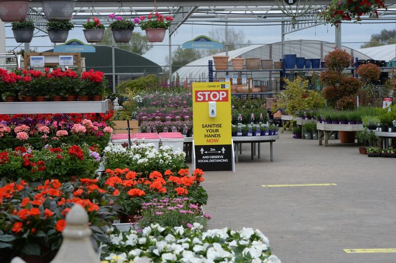 A sign in the garden centre asking people to stop and sanitise their hands. Photograph: Alan Betson/The Irish Times