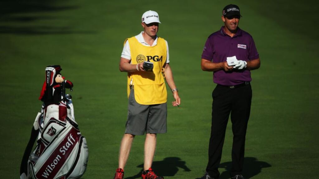 Pádraig Harrington waits alongside caddie Ronan Flood on the 10th hole during the first round of the USPGA Championship in Rochester, New York. Photograph: Andrew Redington/Getty Images
