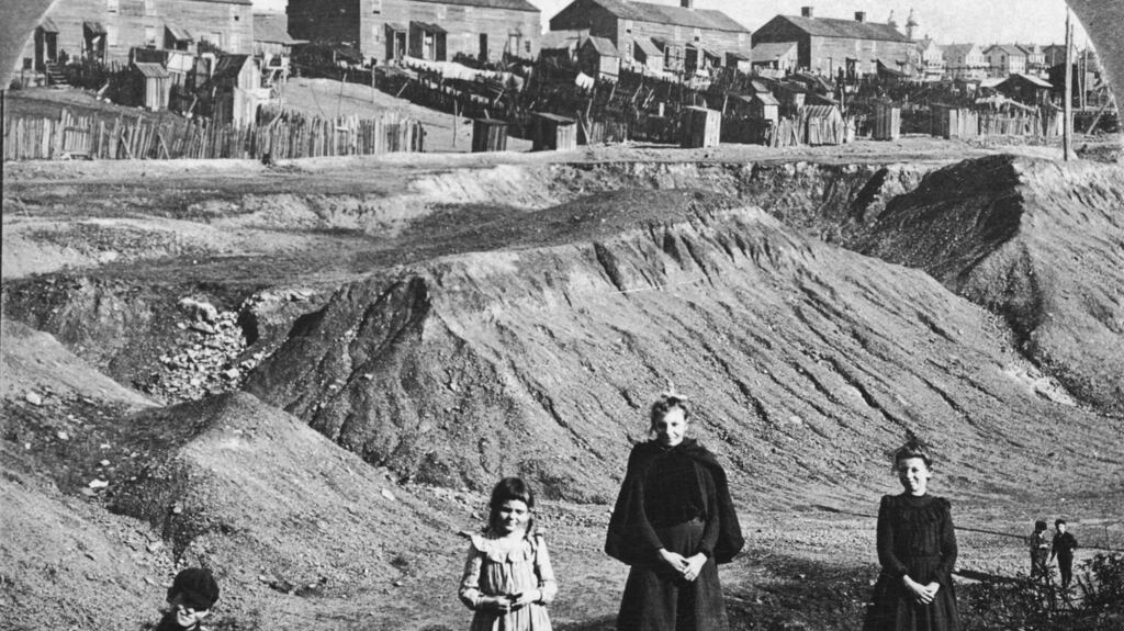 Children of miners pose in a strip mine in front of a row of houses near Hazleton, Pennsylvania, circa 1915. Photograph: Hulton Archive/Getty Images