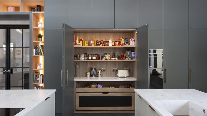 Cabinet units house storage as well as sound-absorbing panels