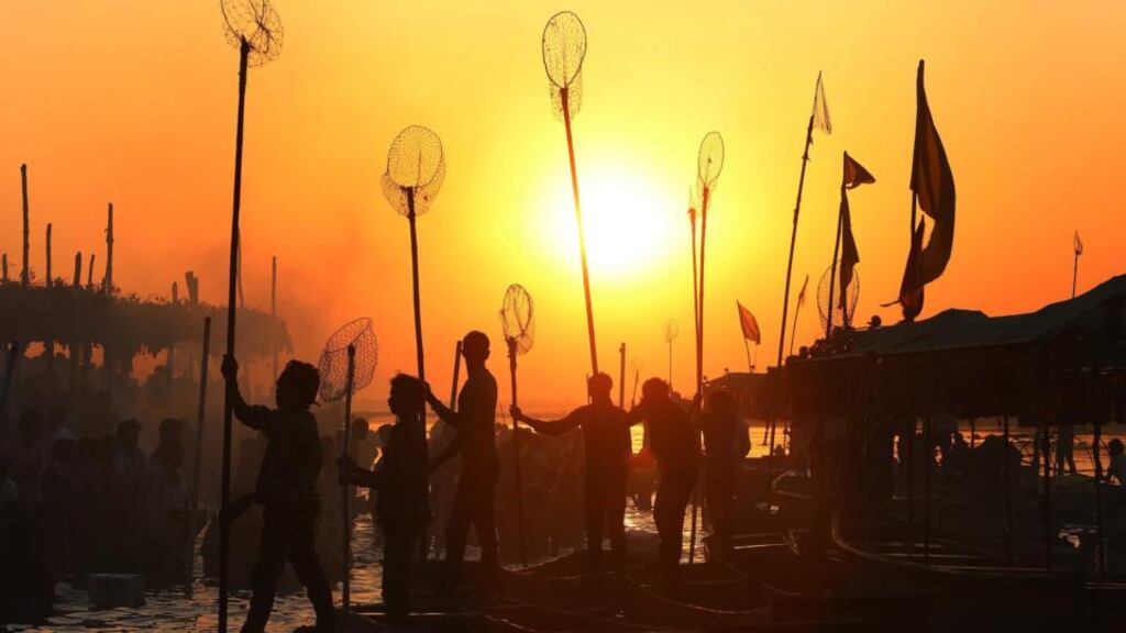 Indian fishermen silhuetted by the rising sun as they prepare for an early morning catch at the banks of Narmada river in Nemawar district Dewas, 200km from Bhopal, Madhya Pradesh, India. Photograph: EPA/SAJNEEV GUPTA