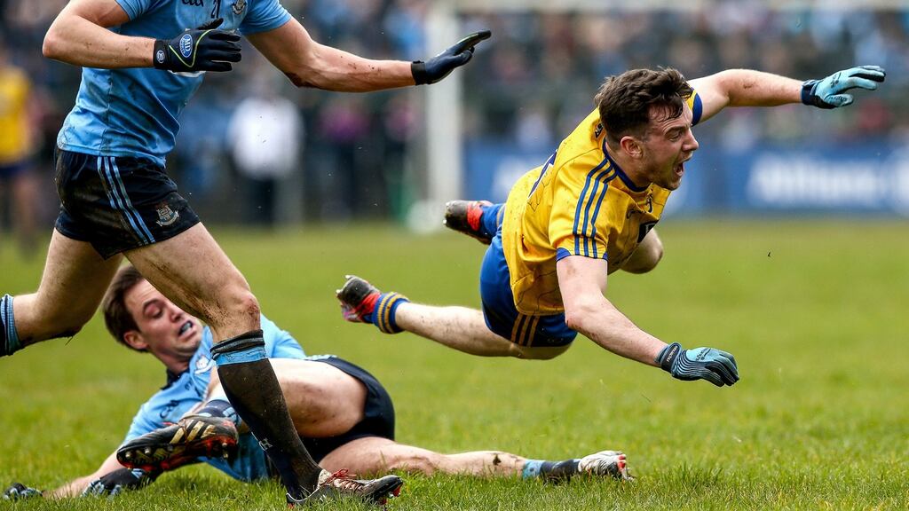 Dublin’s Tomas Brady and Neil Collins of Roscommon clash during their Allianz League match. Photo: James Crombie/Inpho