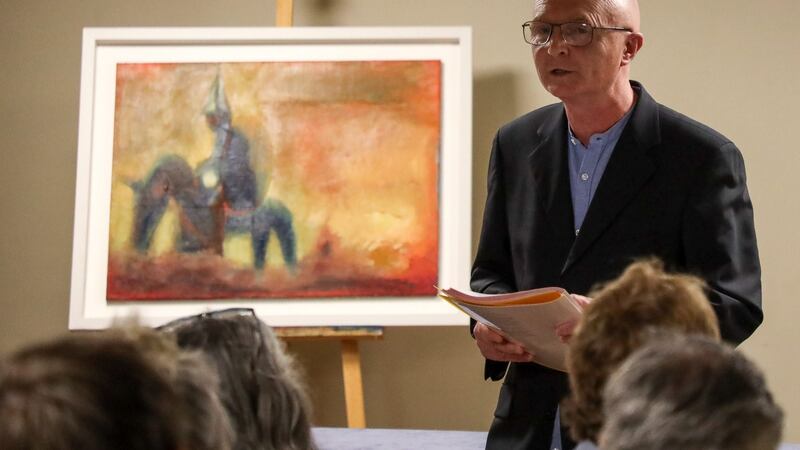 Poet John W Sexton reading from his new work An Ormond Aisling in Steeples Cafe, Nenagh as part of Culture Night 2019. In the background is a painting by local artist Josephine Geaney. Photograph: Odhran Ducie