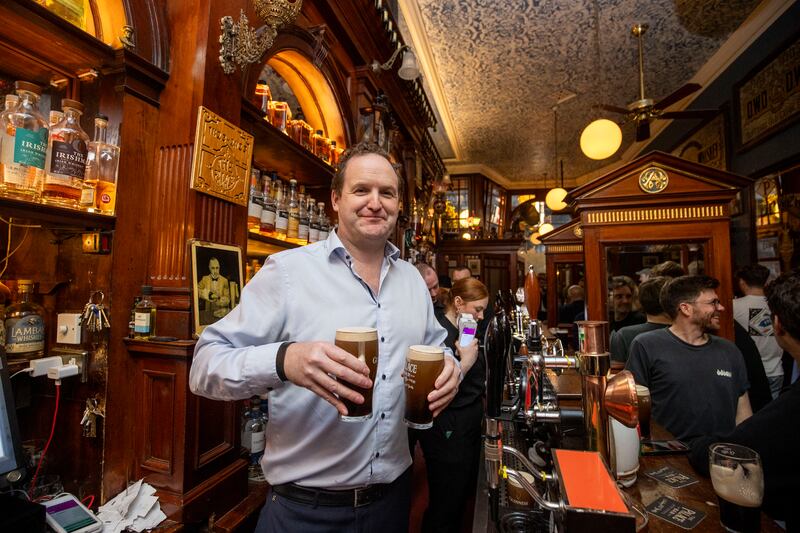 Willie Aherne of the Palace Bar practises his Guinness craft. Photograph: Tom Honan