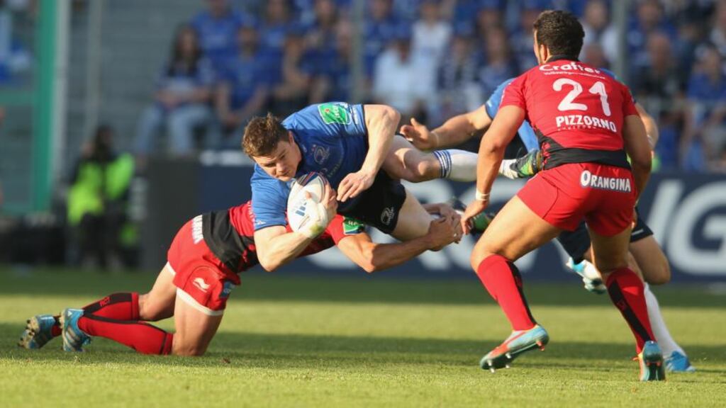 Leinster’s Brian O’Driscoll is tackled by Matt Giteau during the Heineken Cup quarter-final match against Toulon at the Felix Mayol Stadium, Toulon. Photograph: Getty Images