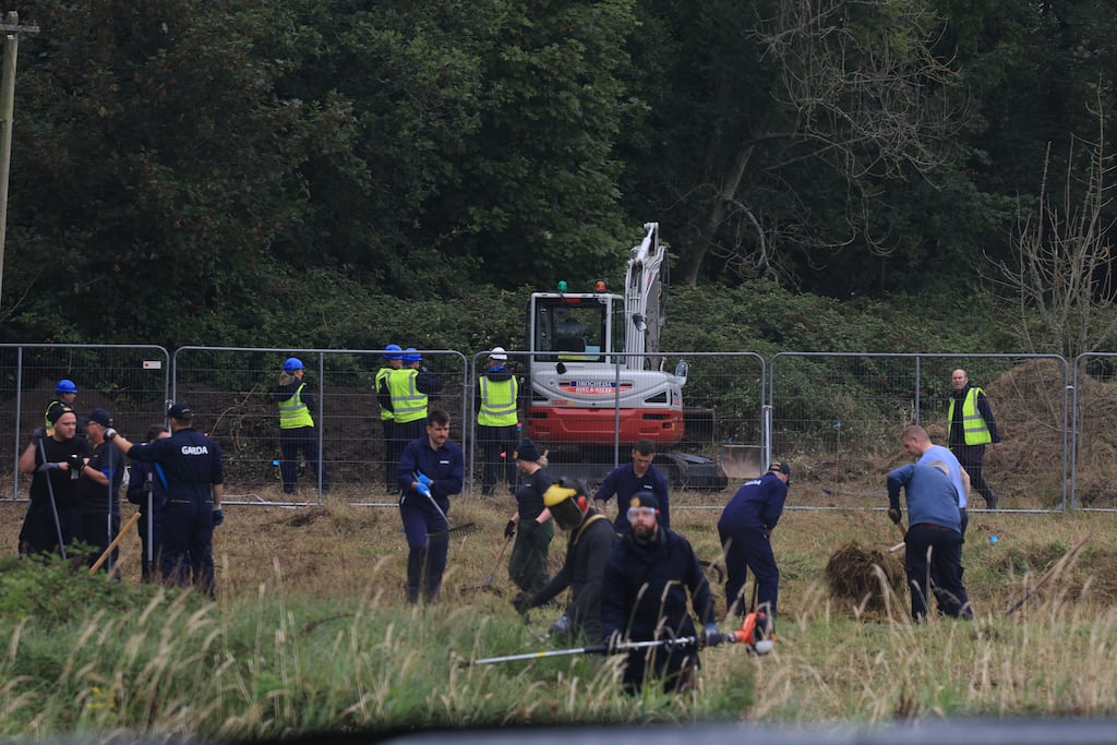 Gardai search an area of open ground on the Portrane Road, Donabate. Photograph: Stephen Collins/Collins Photos