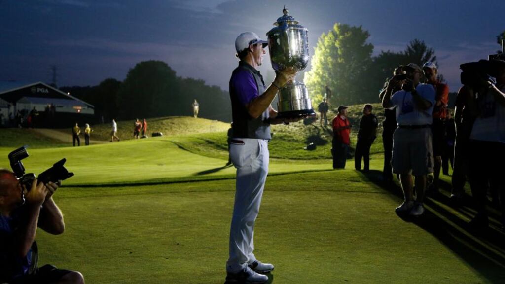 Rory McIlroy holds up the Wanamaker Trophy after winning the PGA Championship at Valhalla in Louisville, Kentucky. It was his second Major win of the year. Photo: John Locher/AP