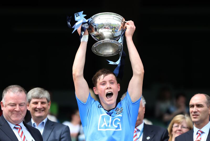 A young Con O'Callaghan lifts the Murray Cup after Dublin's victory over Kildare in the 2014 Leinster minor football final at Croke Park. Photograph: Cathal Noonan/Inpho