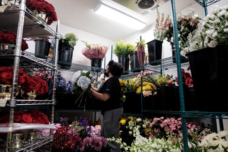 Terra Preston working at Lee’s Flower and Card Shop in Washington. The owner of the shop predicted that flowers would be one of the first expenses eliminated from federal workers’ budgets. Photograph: Michael A McCoy/New York Times