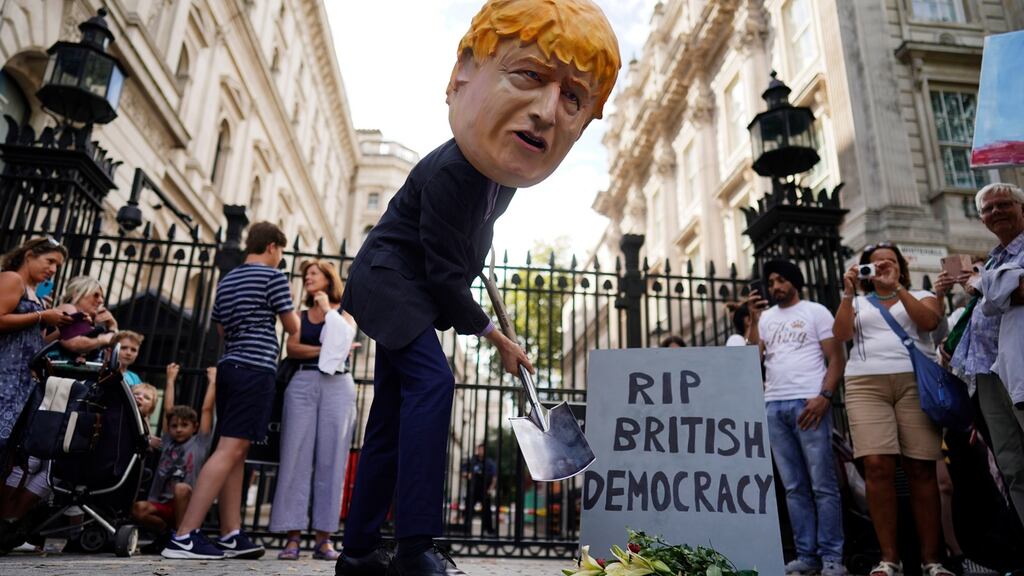 A protester depicting British prime minister Boris Johnson demonstrates at a protest outside Downing Street in London on Wednesday. Photograph: Will Oliver/EPA