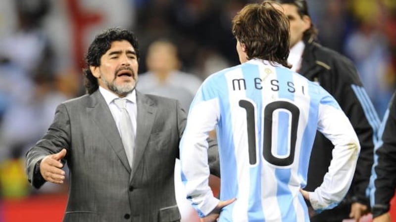 As manager of the Argentina team in 2010, Diego Maradona embraces Lionel Messi after they lose the World Cup quarter-final to Germany. Photograph: Getty Images
