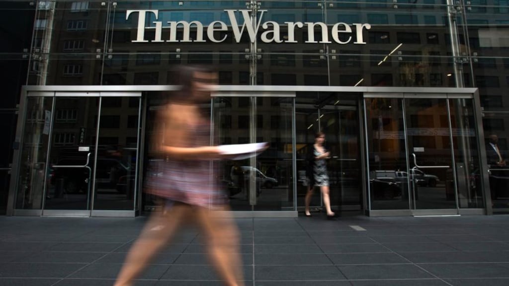 A woman walks past the Time Warner Center near Columbus Circle in Manhattan yesterday. Rupert Murdoch’s 21st Century Fox Inc said it had offered to buy the company in a move that would unite two of the world’s most powerful media conglomerates, but Time Warner rebuffed its offer. Photograph: Reuters