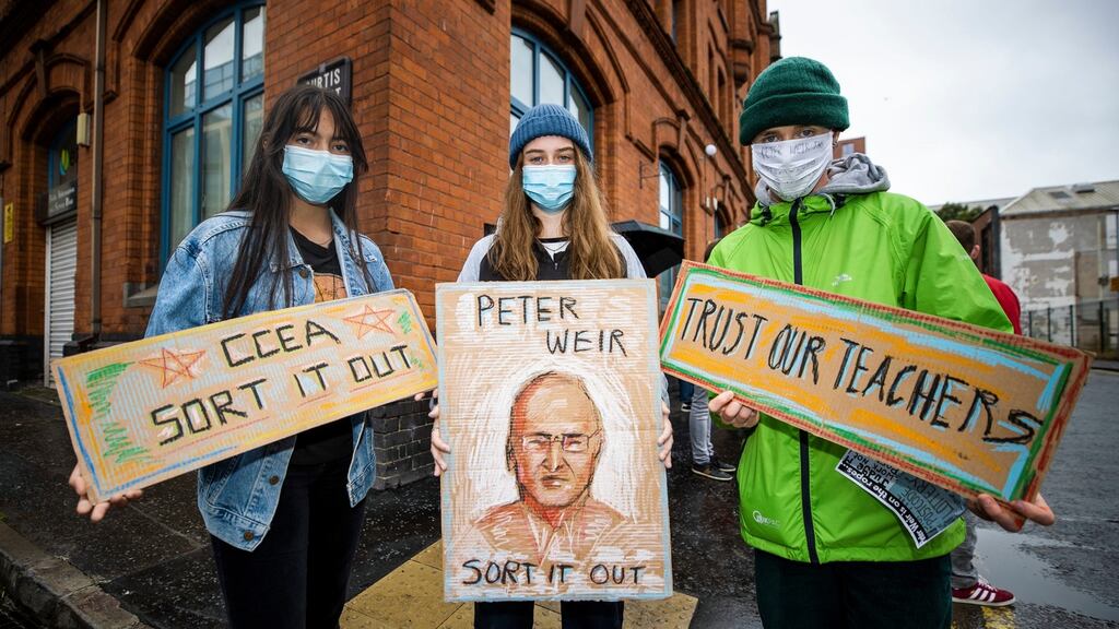 (L to R) Kylie McComb, Kathleen Malone, and Ruben Hughes protest in Belfast over grading by algorithm on Monday. Photograph: Liam McBurney/PA Wire