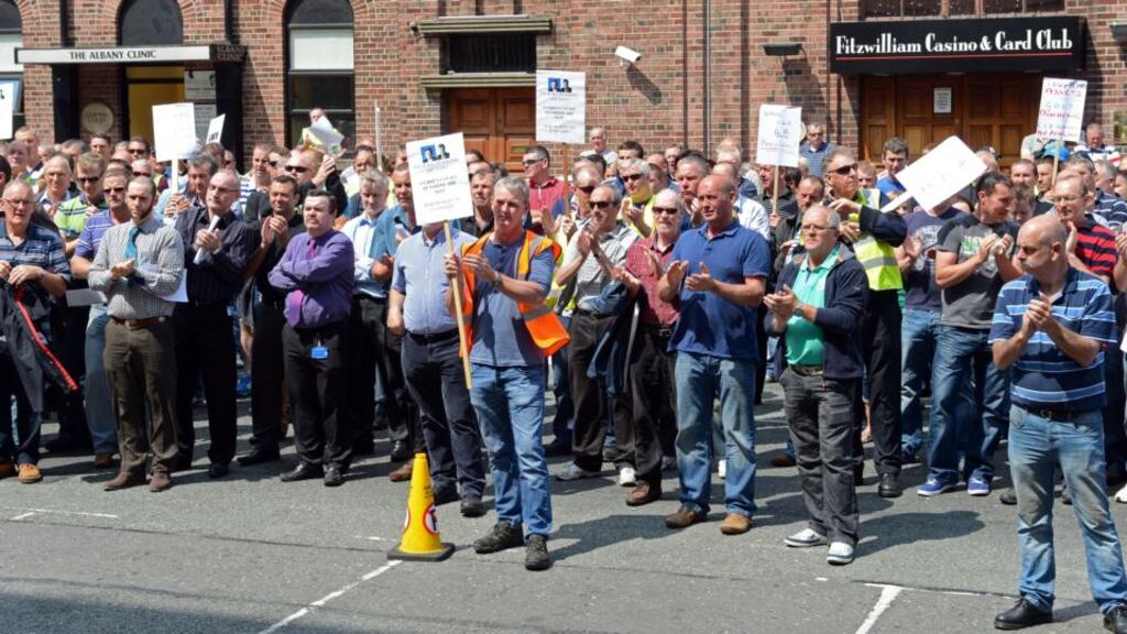 ESB workers hold a protest over concerns about pensions outside ESB headquarters in Dublin. The demonstration took place as the company held its annual general meeting inside. Photograph: Eric Luke/The Irish Times.