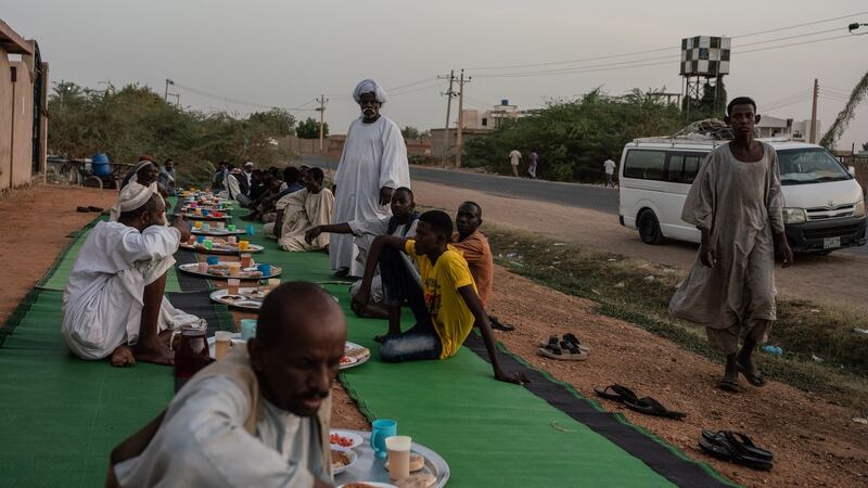 An outdoor iftar meal during Ramadan for neighbors and travellers in the town of El-Kabashi. Photograph: Abdulmonam Eassa/The New York Times