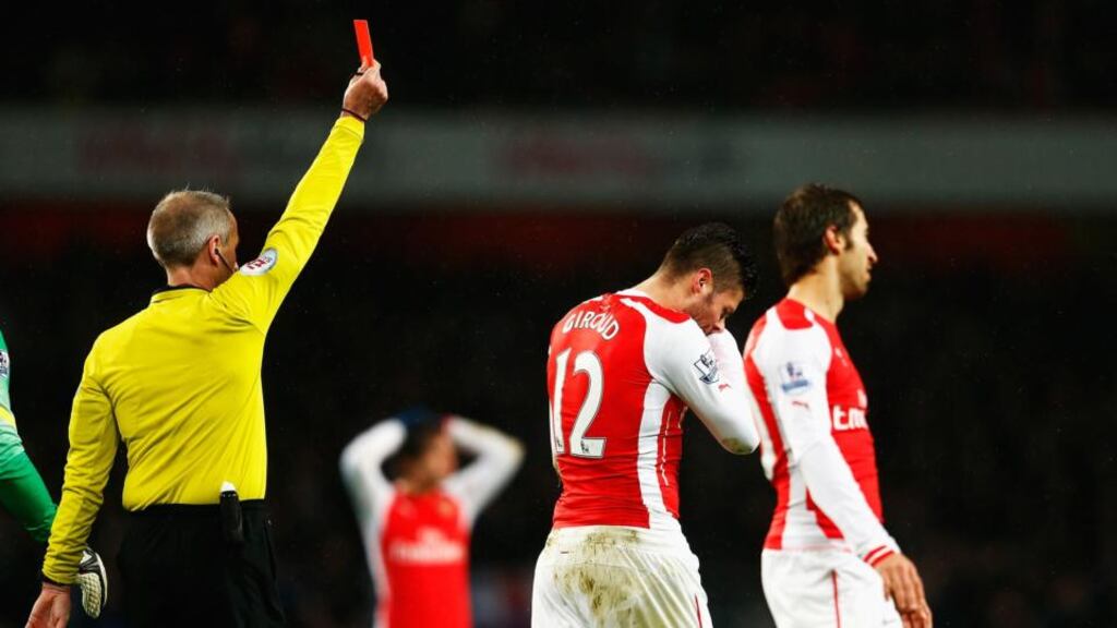 Olivier Giroud of Arsenal is sent off for a head butt on Nedum Onuoha of QPR by referee Martin Atkinson during the Barclays Premier League match between Arsenal and Queens Park Rangers. Photograph: Julian Finney/Getty Images