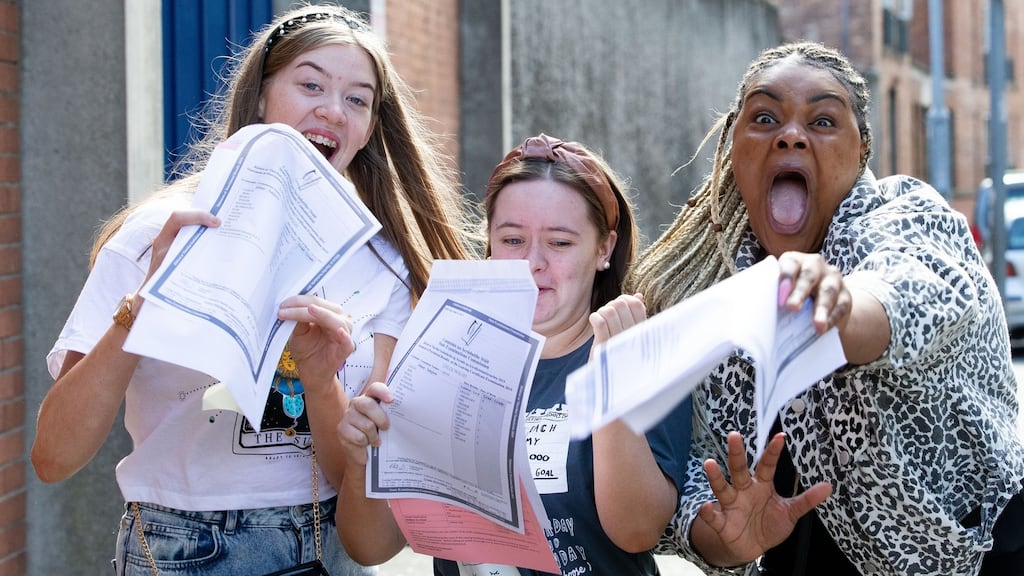 Mount Carmel Secondary School students Sarah Louise Bardon, Chloe Walsh  and Omo Ehimare celebrate after   receiving their Leaving Cert  results. Photograph: Tom Honan