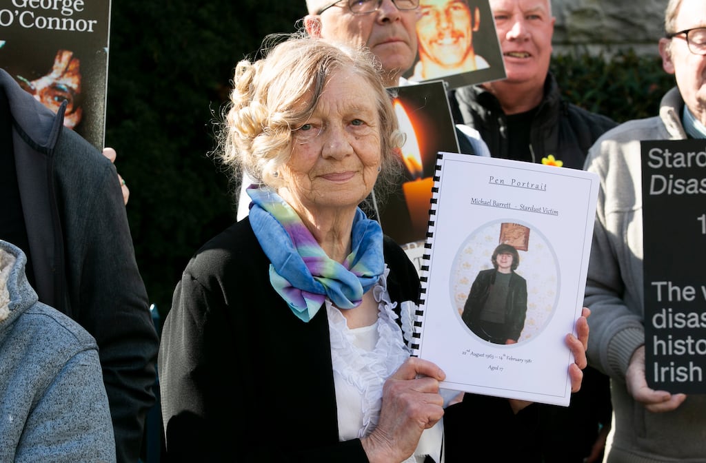 Gertrude Barrett with a 'pen portrait' of her son Michael, who died in the Stardust fire, at the Garden of Remembrance in Dublin before the start of the inquest. Photograph: Gareth Chaney/Collins Photos