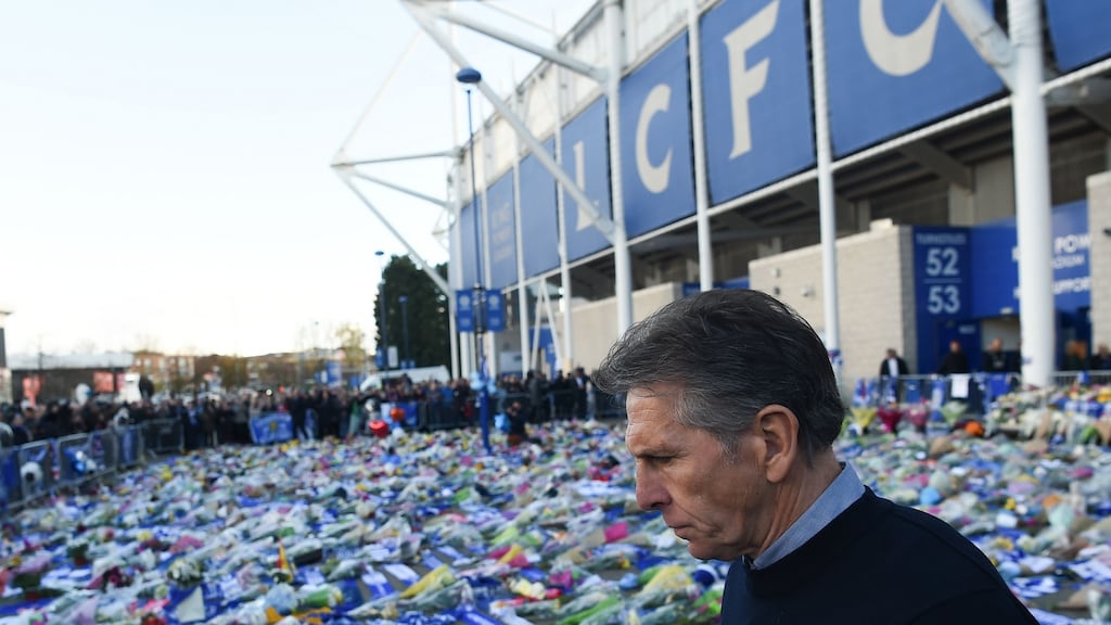 Leicester City manager Claude Puel looking at the floral tributes to the five victims of the helicopter crash which killed Leicester City’s chairman Vichai Srivaddhanaprabha. Photograph: Paul Ellis/AFP/Getty Images