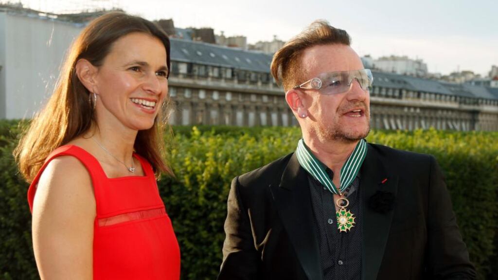 U2 singer Bono with French culture minister Aurelie Filippetti after he was made a Commander of the Order of Arts and Letters in Paris yesterday. Photograph: Reuters/Charles Platiau